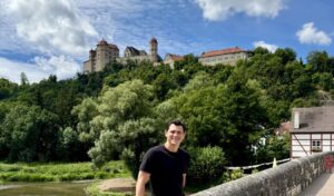 Nomadic Matt posing for a photo on a sunny day while exploring the Black Forest area of Germany